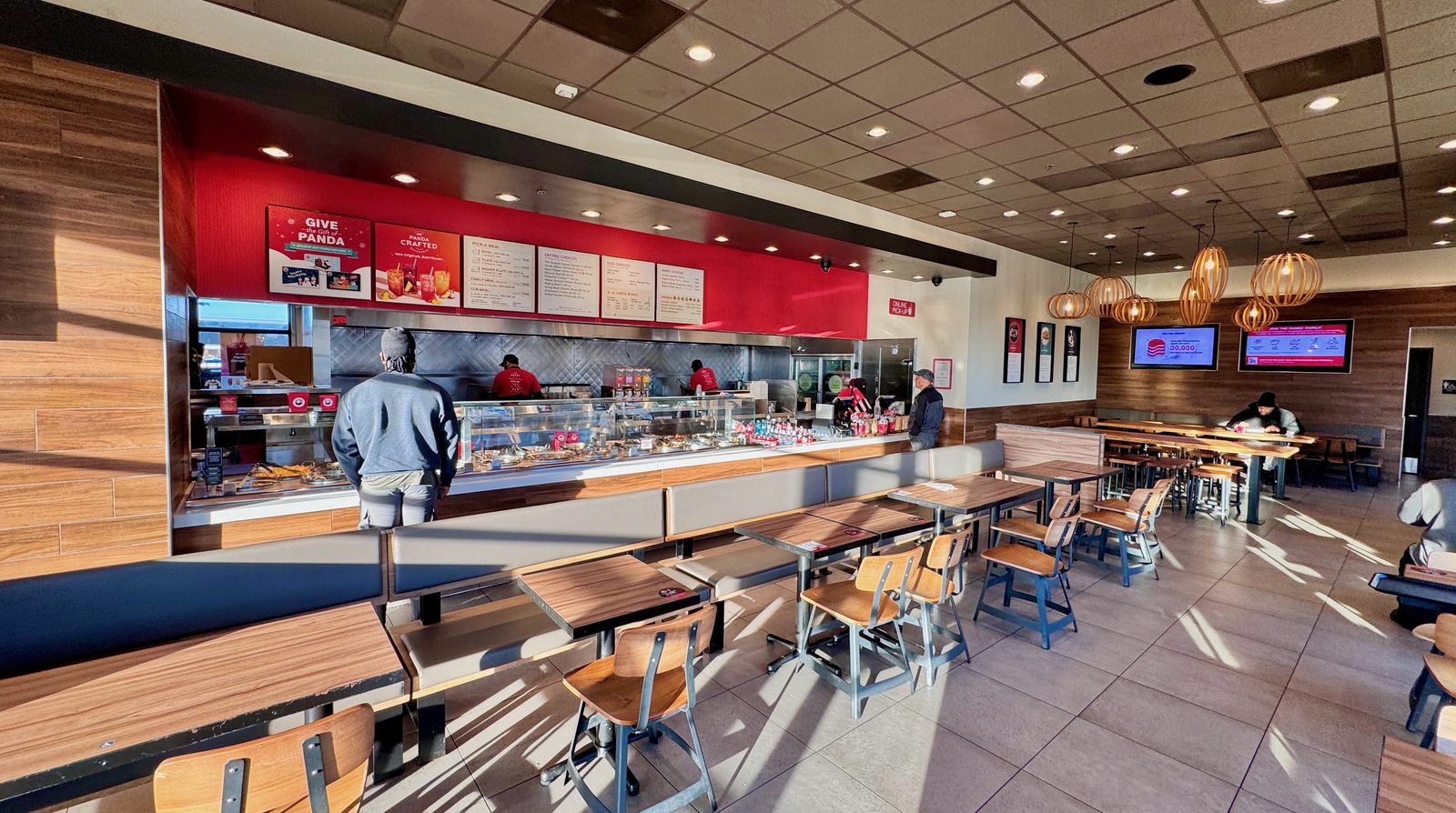 A restaurant service counter with staff