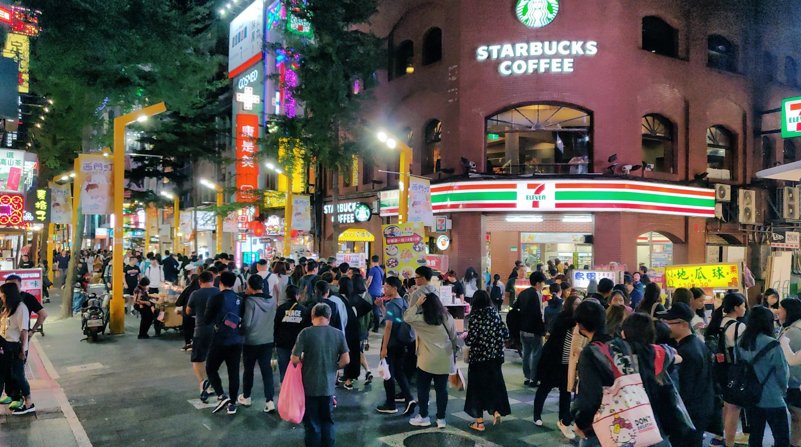 A Starbucks store on a busy Asian street