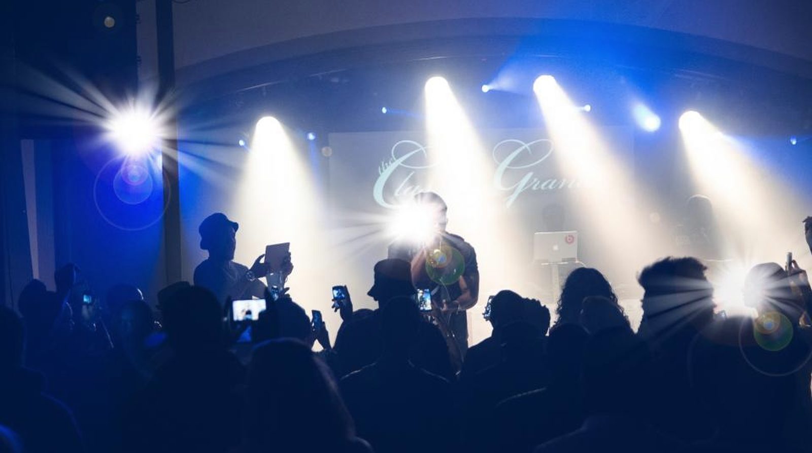 Stage lighting rig illuminating a live event